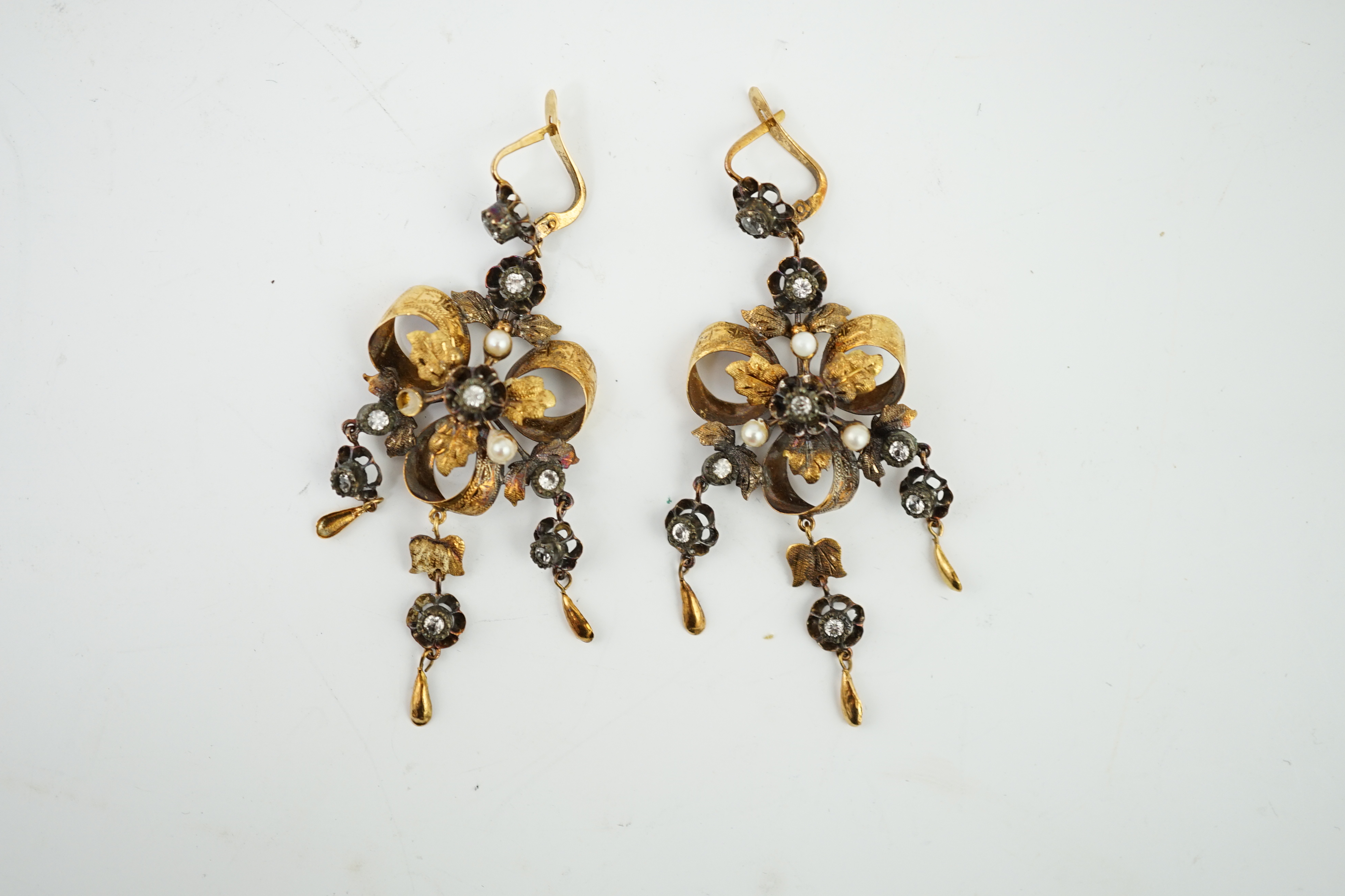 A pair of Victorian gold, seed pearl and simulated diamond set triple drop earrings